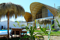 Kites Mancora has plenty of palm thatched umbrellas for lounging by the pool